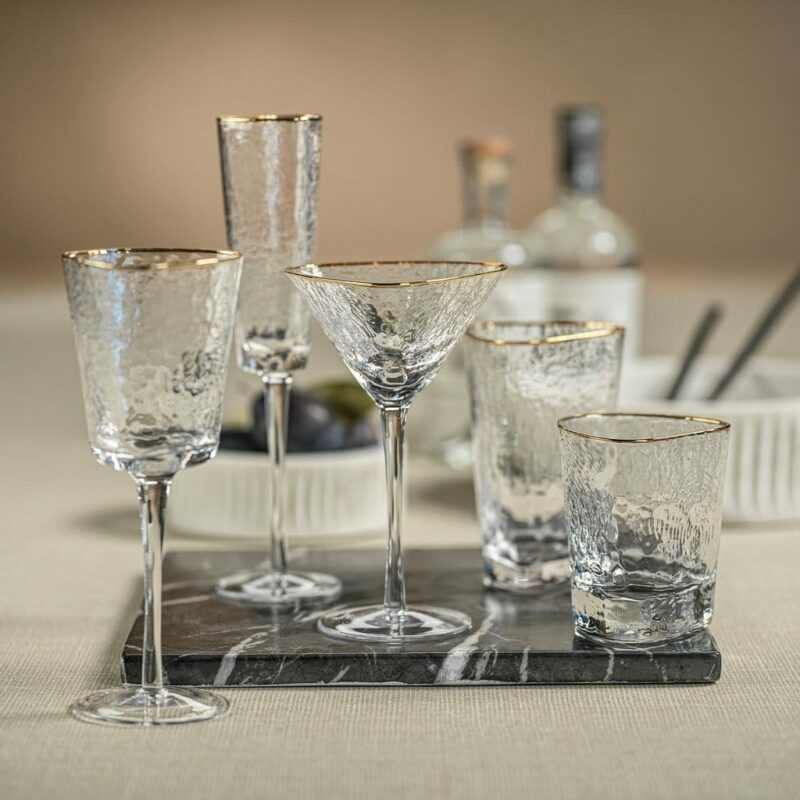 gold-rimmed, triangular-shaped cocktail glass collection