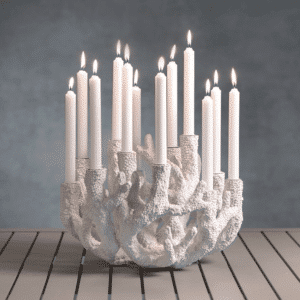 white faux coral taper holder features 12 light candelabra style display. Made for dining table or coffee table with summer coastal design