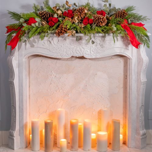 Mantle Kit decoration of cedar and ribbon with pinecones, eucalyptus and gold leaves with preserved roses in red